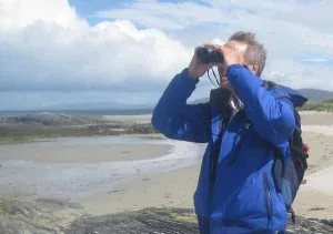George with binoculars